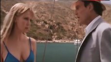 9. Laura Harris in Sexy Blue Bikini Scene – Suicide Kings