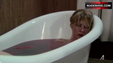 4. Jenna Elfman in Bathtub – Damages