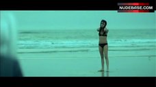 6. Mila Kunis in Bikini on Ocean Beach – Moving Mcallister