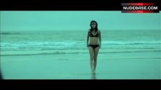 7. Mila Kunis in Bikini on Ocean Beach – Moving Mcallister
