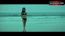9. Mila Kunis in Bikini on Ocean Beach – Moving Mcallister