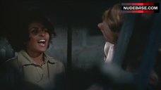 5. Roberta Collins Topless Tied to Wheel – Women In Cages