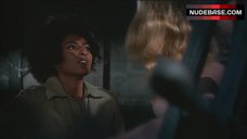 7. Roberta Collins Topless Tied to Wheel – Women In Cages