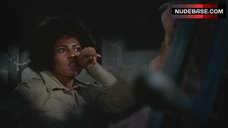 8. Roberta Collins Topless Tied to Wheel – Women In Cages