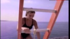 1. Nicole Eggert Hot in Black Swimsuit – Baywatch
