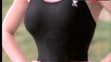 4. Erika Eleniak Sexy in Black Swimsuit – Baywatch