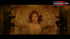 2. Milla Jovovich Cleavage – The Three Musketeers