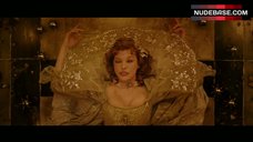 3. Milla Jovovich Cleavage – The Three Musketeers