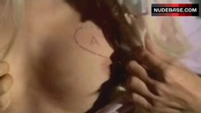7. Anita Pallenberg Tattoo on Boobs – Candy