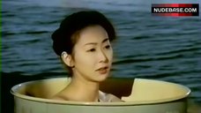 4. Misa Jono Bathing in Oil Drum – Nurunuru Kankan