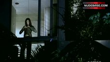 1. Famke Janssen in Bra Against Window – Nip/Tuck