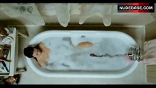 1. Tania Saulnier Boobs Flash in Tub – Slither