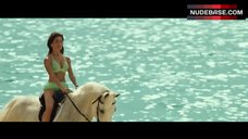 1. Caterina Murino Riding Horse in Bikini – Casino Royale