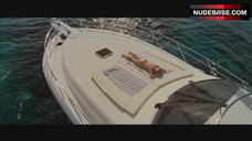 34. Ashley Scott Topless Sunbathing – Into The Blue