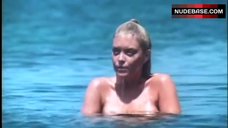 7. Lydia Cornell Swimming Topless – Blood Tide