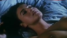 8. Monica Bellucci Topless in Bed – Vita Coi Figli