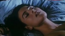 9. Monica Bellucci Topless in Bed – Vita Coi Figli
